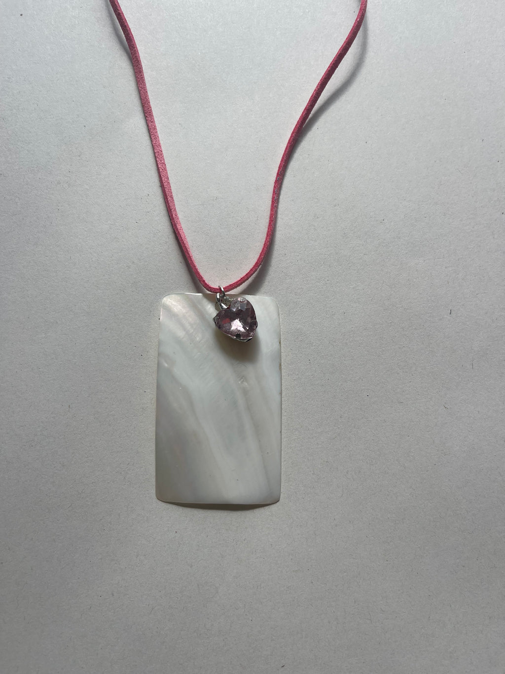 Rectangle shell on pink leather